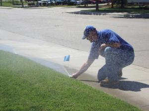 one of our Santa Rosa sprinkler Optimization techs adjusting a sprinkler head